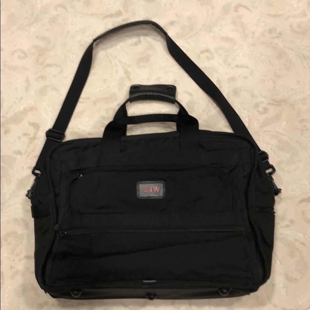 Tumi expandable crossbody suitcase/briefcase